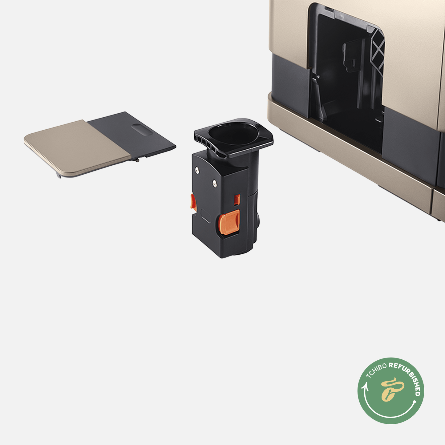 Nahaufnahme der Brühgruppe des Tchibo Esperto Caffè in Metallic Sand. Die Maschine ist im Hintergrund leicht erkennbar, und die abnehmbare Seitenklappe liegt daneben.