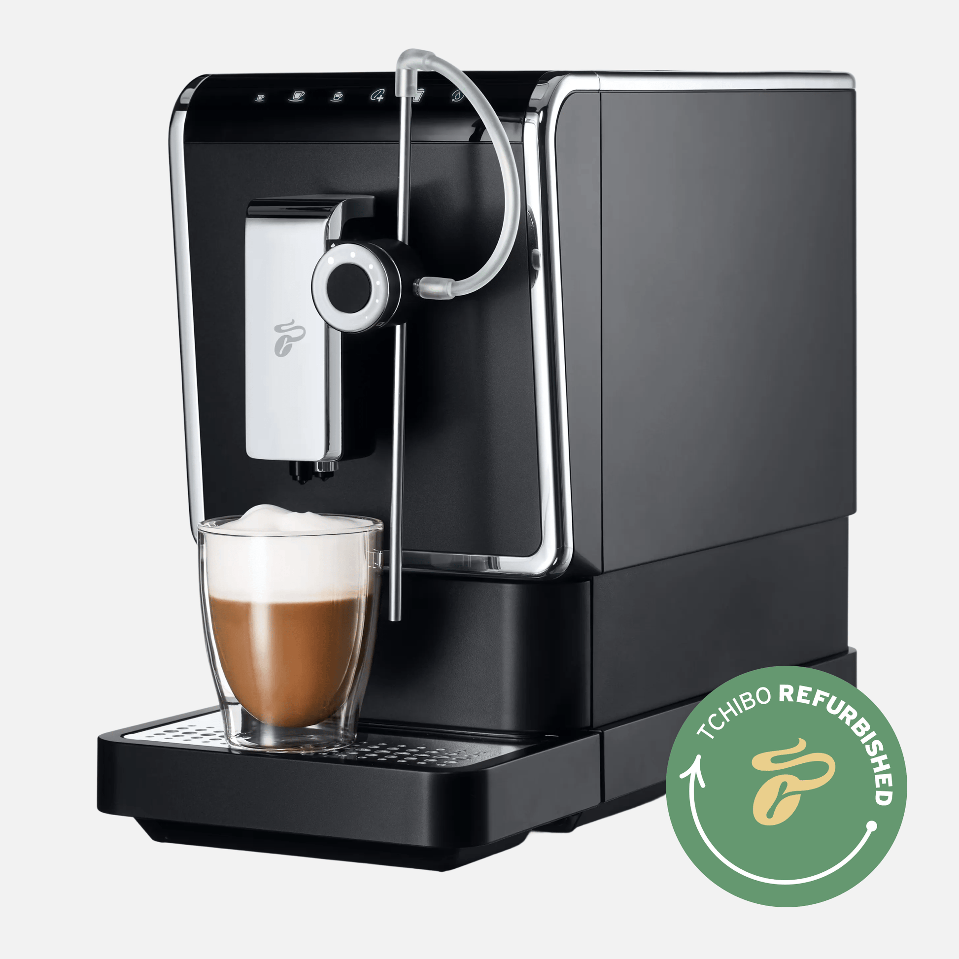 Tchibo Esperto Pro Kaffeevollautomat in Schwarz-Silber mit Latte-Macchiato-Glas und "Tchibo Refurbished"-Logo